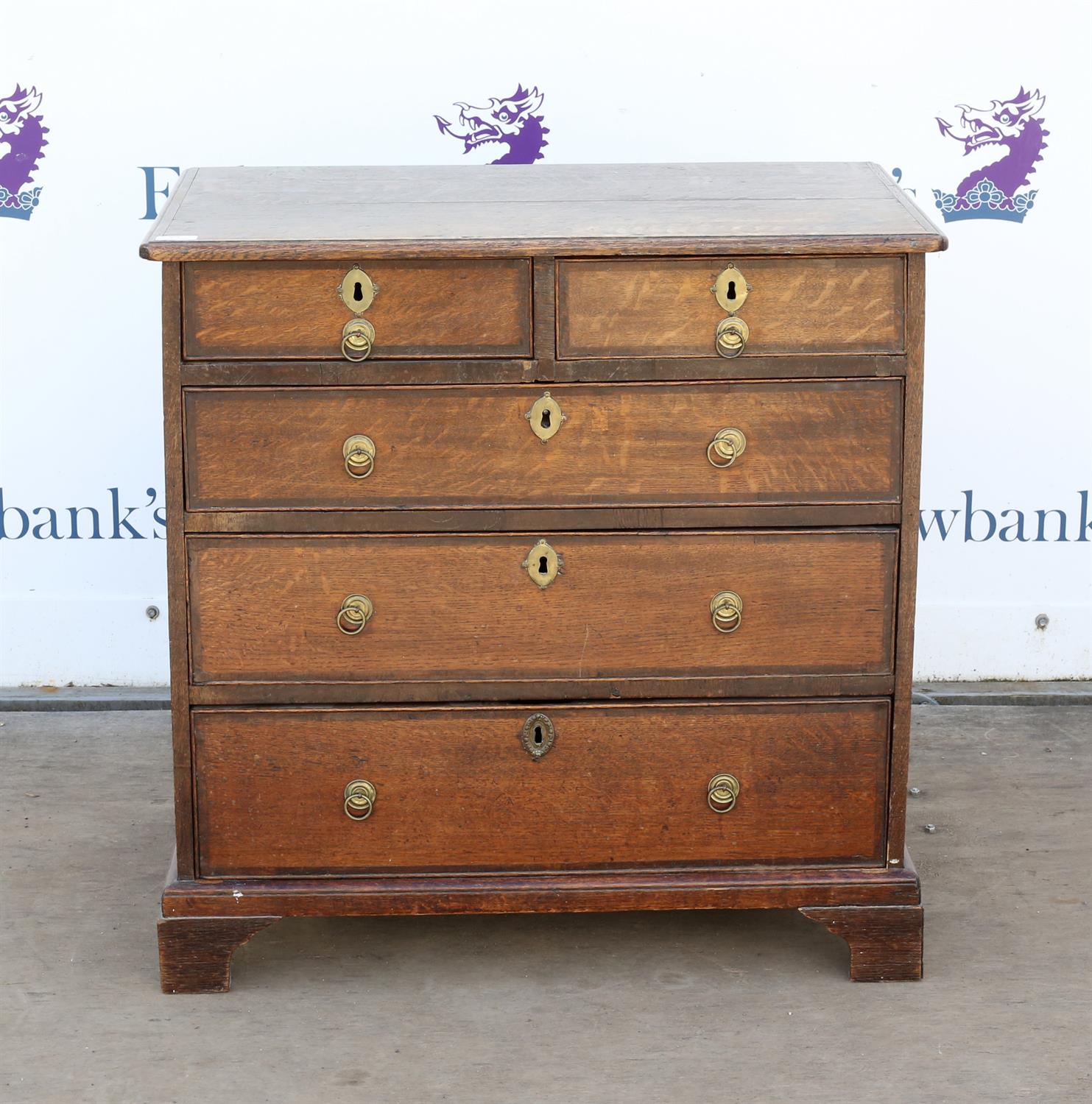 George II oak chest of two short and three long graduated drawers on later bracket feet,