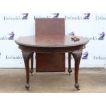 1920s mahogany extending dining table, the oval top with gadrooned edge on carved cabriole legs