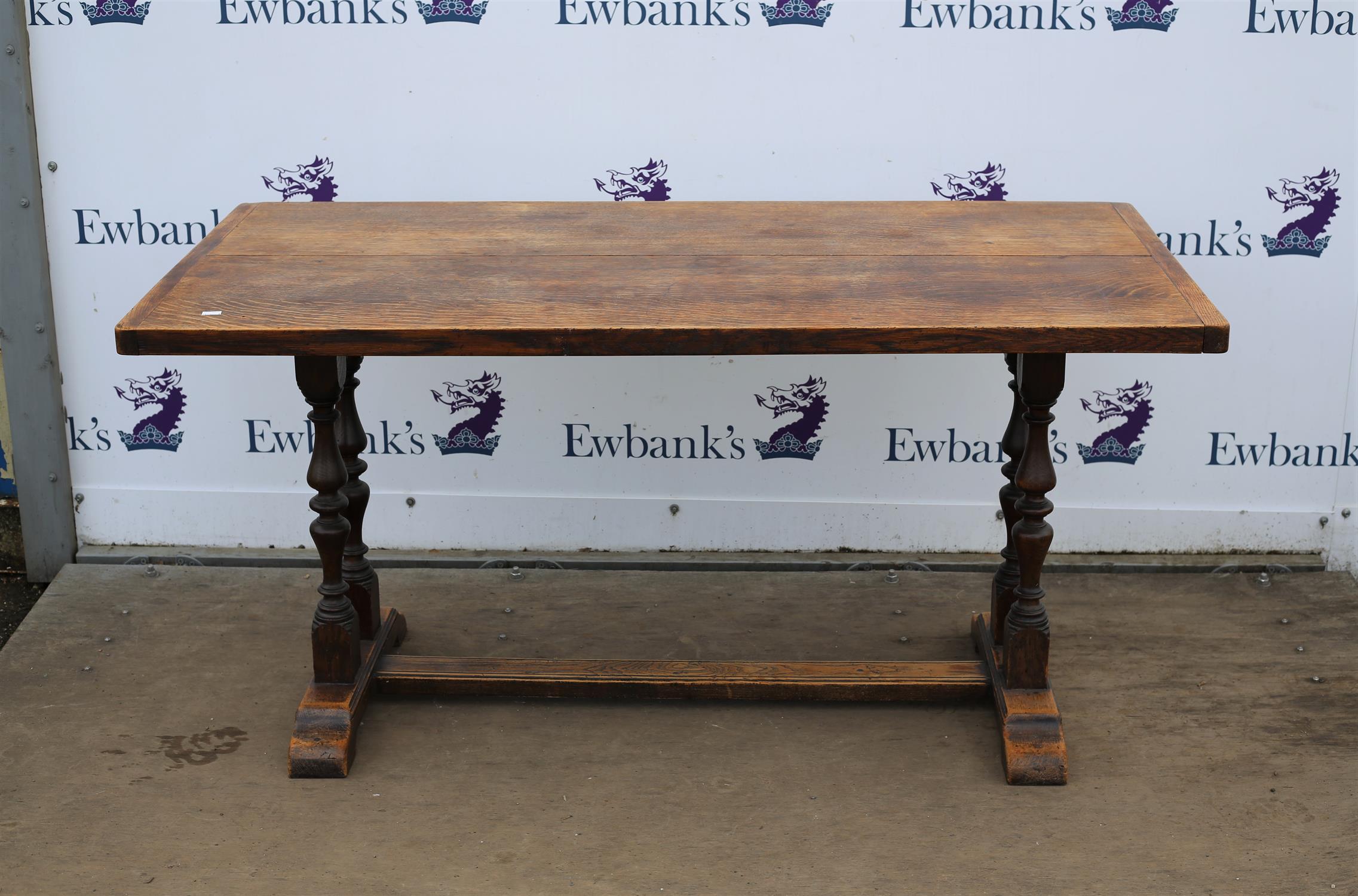 Reproduction oak refectory table, two plank top on end supports with uniting stretcher,