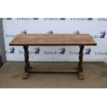 Reproduction oak refectory table, two plank top on end supports with uniting stretcher,