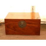 Chinese camphorwood chest of rectangular form with hinged lid, brass catch and carrying handles,