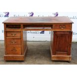 Late 19th century mahogany pedestal writing desk, the leather inset top over frieze drawers,