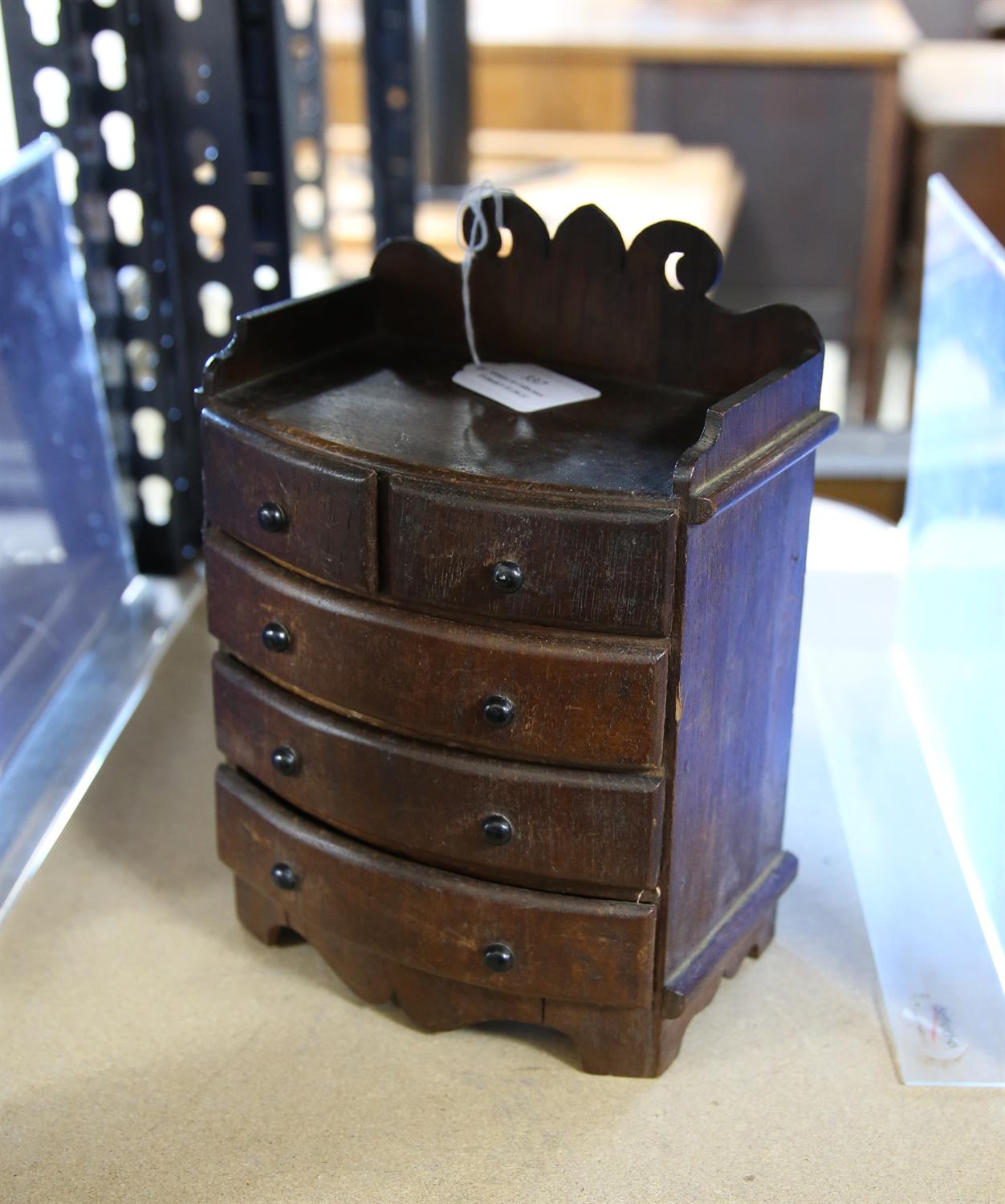 Miniature Victorian bowfront chest of drawers, with fret carved raised back, H24.5 W17.5 D11 cm