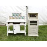 Early 20th century cream painted wash stand with marble top and tiled tiled back together with a