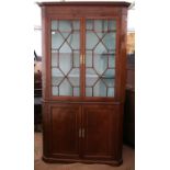 19th century mahogany corner cabinet, the dentil cornice over a pair of astragal glazed doors and