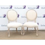 Pair of French style stained wood dining chairs, with oval upholstered backs and moulded cabriole