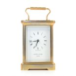 Mappin & Webb brass carriage clock with lever movement, the white enamelled dial with Roman