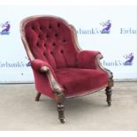 Victorian button back armchair with carved mahogany showframe on turned front supports