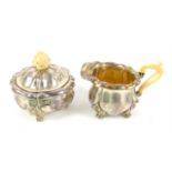 Late 19th/ early 20th century German planished silver cream jug and sugar bowl with ivory handles,