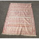 Silk mix kilim rug, in red and cream with lines of geometric designs, 149 x 107 cm