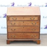 George III oak bureau, the sloping fall enclosing pigeon holes and drawers over three long