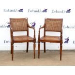 Pair of Regency style stained beech carver chairs, the double caned backs over caned seats on