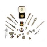 Boxed military medallion, Some silver coins and other items including silver handled manicure