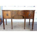 19th century mahogany serpentine fronted sideboard with a single long drawer above tambour slide