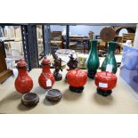 Red cinnabar lacquered vases, jars, pair of green lacquered vase and two sculptures,