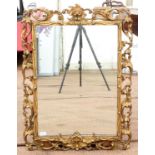 20th century giltwood wall mirror, with open scroll frame, 89 x 68 cm