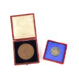 Cased large bronze diamond jubilee medallion of Queen Victoria 1837-1897 and a cased silver