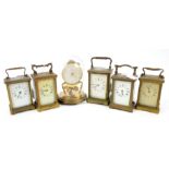 Five French brass carriage timepieces and an anniversary clock