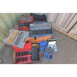 Mixture of garage equipment, drill bits, sockets and other tools.