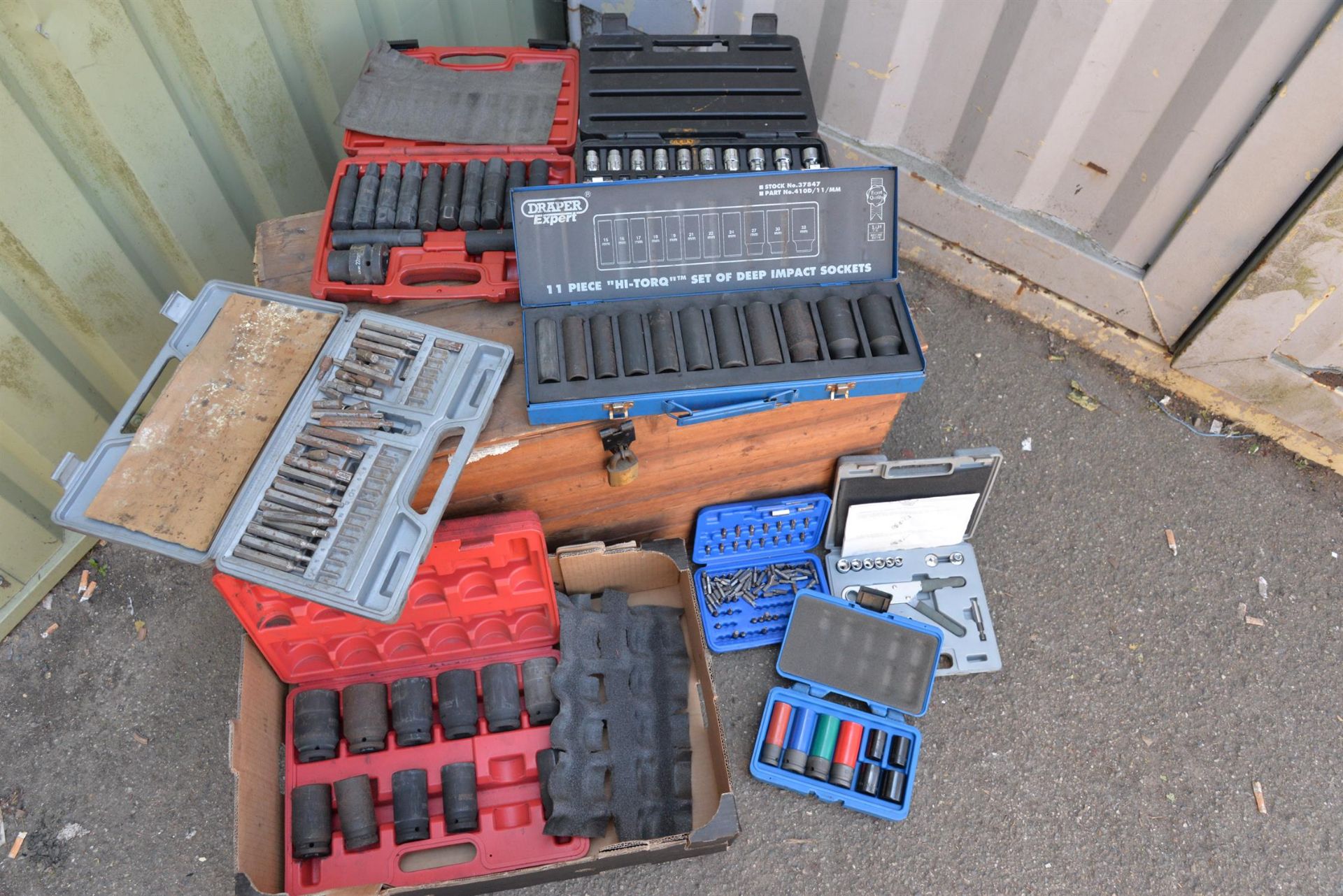Mixture of garage equipment, drill bits, sockets and other tools.