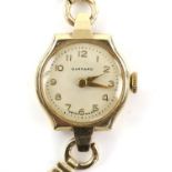 Garrard wristwatch, on a bracelet strap, with cream dial and Arabic numerals, with a 9 ct gold case