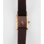 Cartier, a ladies Must de Cartier gold plated wristwatch the signed brown dial with gold hands,