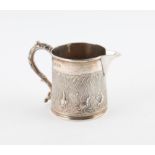 George IV silver cream jug with embossed decoration of marsh birds and reeds, maker's mark rubbed,