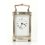 Modern silver Garrard & Co. serpentine carriage clock, with lever movement, the white enamelled