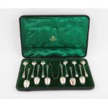 Matched set of twelve late Victorian/Edward VII silver teaspoons and sugar tongs with decorative