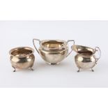 Silver cream jug and sugar bowl with pad feet, bowl 8 cm diameter, and another silver sugar bowl,