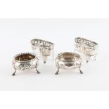 Pair of Victorian silver salts with gadrooned rims, embossed floral decoration on three hoof feet,