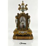 Late 19th century porcelain and gilt metal mantle clock with two train movement striking on a bell,