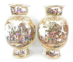Pair of Large Dresden vases, depicting travellers outside inns and houses, within gilt scroll and