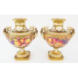 Pair of Royal Worcester twin-handled vases painted with fruit, one by P. Platt, the other S.