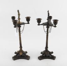 Pair of 19th century bronze three light candelabra, possibly French, with figural finial and chains,
