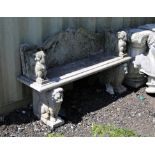 Stone garden seat, the rectangular seat on reconstituted stone lion supports, seat 142 x 42 cm,