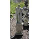 White painted reconstituted stone figure of a Classical male nude on an arabesque style plinth,