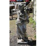 Reconstituted stone figure of a maiden holding a cornucopia of fruit, 124cm high,