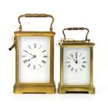 19th century French brass carriage clock with lever movement, the white enamelled dial with Roman