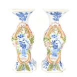 Pair of continental faience vases with under glazed blue and polychrome decoration H29cm