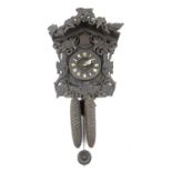 Black Forest cuckoo clock, with ivy and bird frame, cone form weight and timber pendulum, 33 cm high