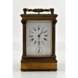 Early 20th century French brass repeating carriage clock with alarm sounding on a gong,
