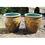 Pair of green and blue glazed garden urns with dragon decoration, 43 cm high, 43 cm diameter and a