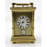 Modern French brass repeating carriage clock with alarm, striking the hours and half hours on a