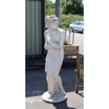 White painted reconstituted stone figure of Venus, on a circular base, 157 cm high