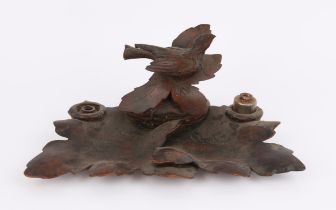 Late 19th/early 20th century inkstand carved with a bird and foliage,33 cms wide PROVENANCE; A