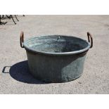 Large zinc basin with twin iron handles, 79 cm diameter