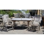Teak patio table with rounded ends, H75 W120 L180 cm, and six folding chairs (7)