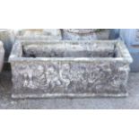 Reconstituted stone rectangular planter, cast with putti, on scroll form supports, H64 W90 D40