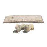 Reconstituted stone curved garden seat, with lion and ball supports on moulded bases,